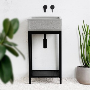Lavabo grigio t.b.t. con struttura in metallo nero e rubinetto.