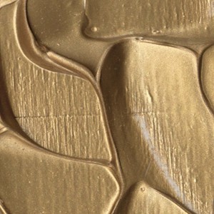 Primo piano di una superficie di vernice dorata e strutturata per progetti fai-da-te.