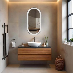 Specchio da parete ovale t.b.t. con illuminazione LED in bagno moderno.