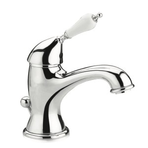 Rubinetto lavabo o bidet lucido con maniglia bianca.