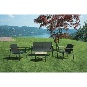 Set di mobili da giardino t.b.t. con divano, tavolo e due sedie su prato.