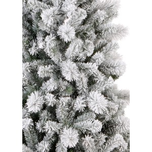 Dettaglio di un albero di Natale artificiale innevato.