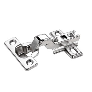 Primo piano di una cerniera per mobili color argento per la costruzione di mobili.