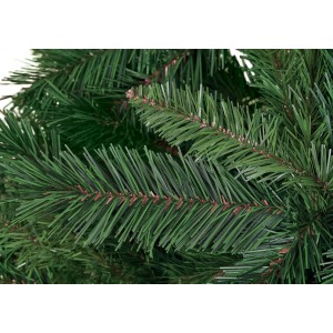 Dettaglio di un albero di Natale artificiale con aghi verdi.