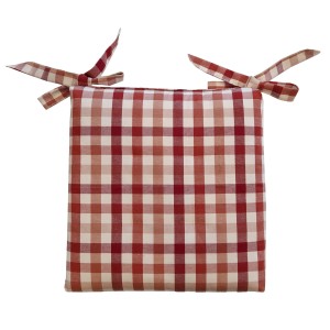 Cuscino per sedia a quadri rossi e bianchi con lacci.