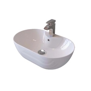 Lavabo da appoggio ovale bianco con rubinetto.