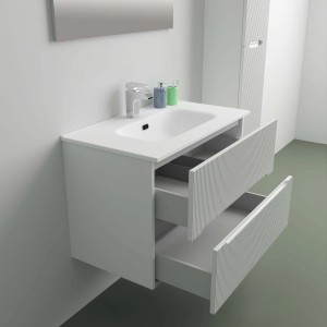 Mobile bagno bianco con due cassetti aperti in un bagno moderno.