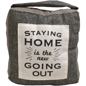 Fermaporta grigio con scritta "Staying Home is the new Going Out".