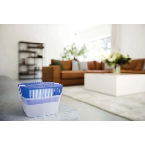 Deumidificatore t.b.t. con coperchio blu, posizionato in un soggiorno.