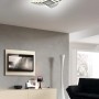 Plafoniera LED t.b.t. moderna con design curvo per spazi abitativi.