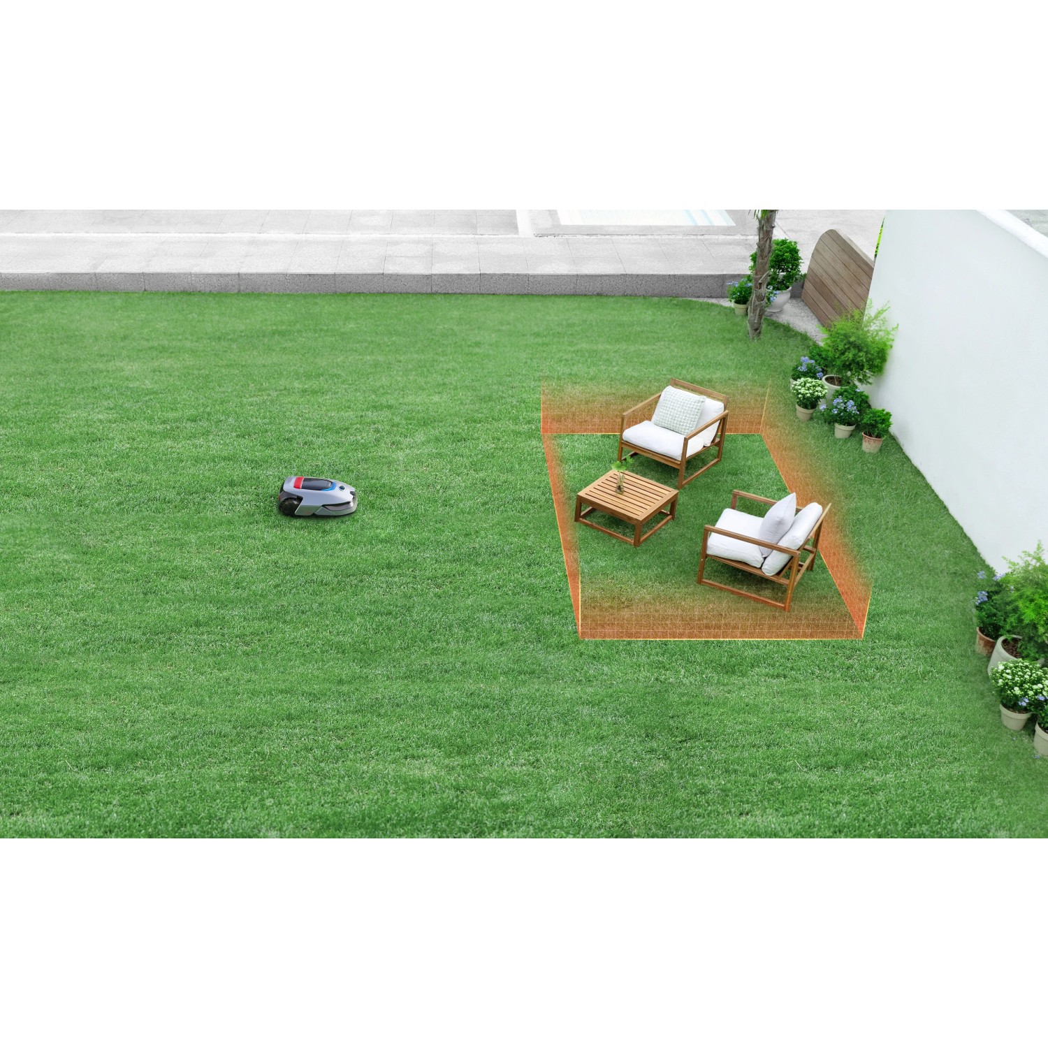 Robot rasaerba Dreame A2 su prato con mobili da giardino e perimetro.