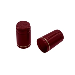 Due capsule rosse t.b.t. con bordo dorato per bottiglie di vino.