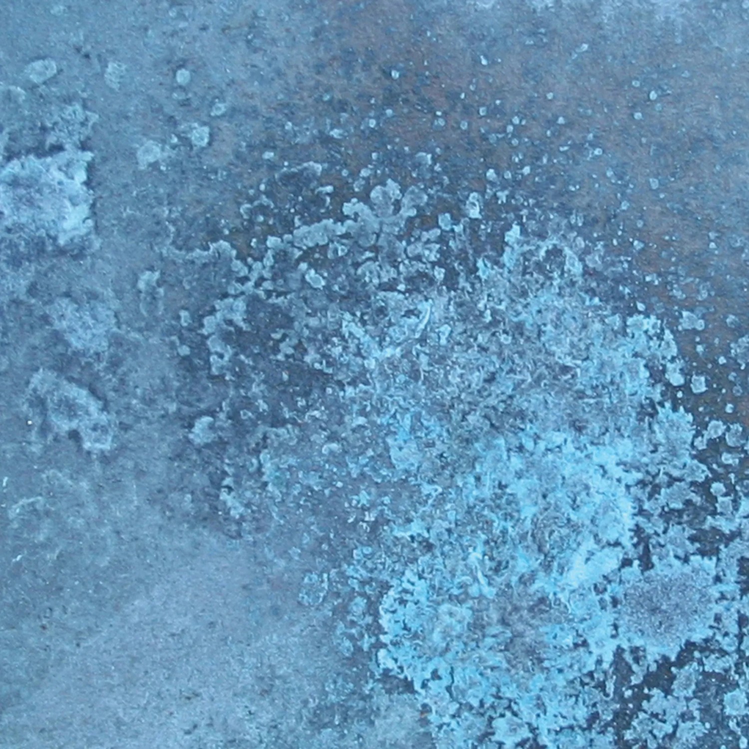 Primo piano di una texture di vernice blu-turchese per progetti fai-da-te.