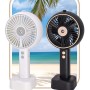 Due ventilatori t.b.t. bianchi e neri con sfondo spiaggia.