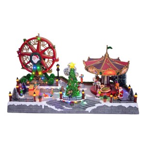 Decorazione natalizia luminosa: giostra e ruota panoramica con figure.