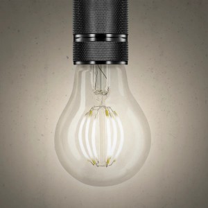 Lampadina LED E27 t.b.t. con vetro trasparente e base nera.