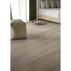 Pavimento vinilico chiaro t.b.t. in soggiorno con pouf e letto.