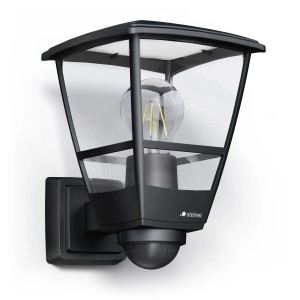 Lampada da esterno nera Steinel L 10 S con sensore e vetro trasparente dal design nostalgico.