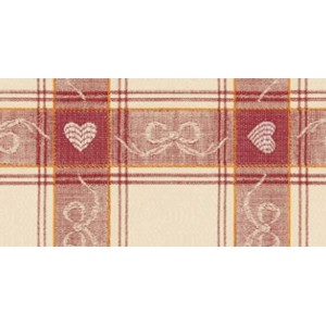 Dettaglio di una tovaglia a scacchi con motivo a cuore e fiocco.