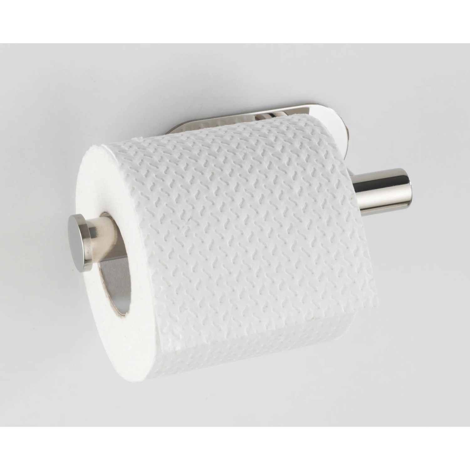 Porta carta igienica Wenko Orea Shine in acciaio inox lucido con rotolo di carta.