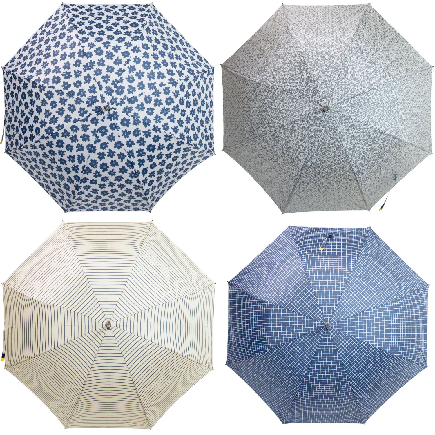 Vari ombrelli t.b.t. con motivi floreali, a righe e a quadri.