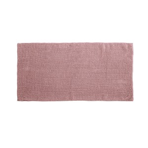 Tappeto da bagno rettangolare rosa con struttura a nodi.