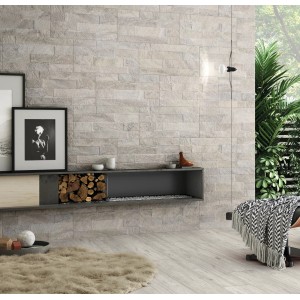 Rivestimento murale con piastrelle da rivestimento t.b.t. grigio chiaro effetto pietra.