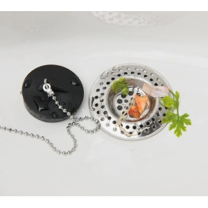 Set da 2 filtri di scarico Wenko in acciaio inox nel lavello con scarti di cibo.