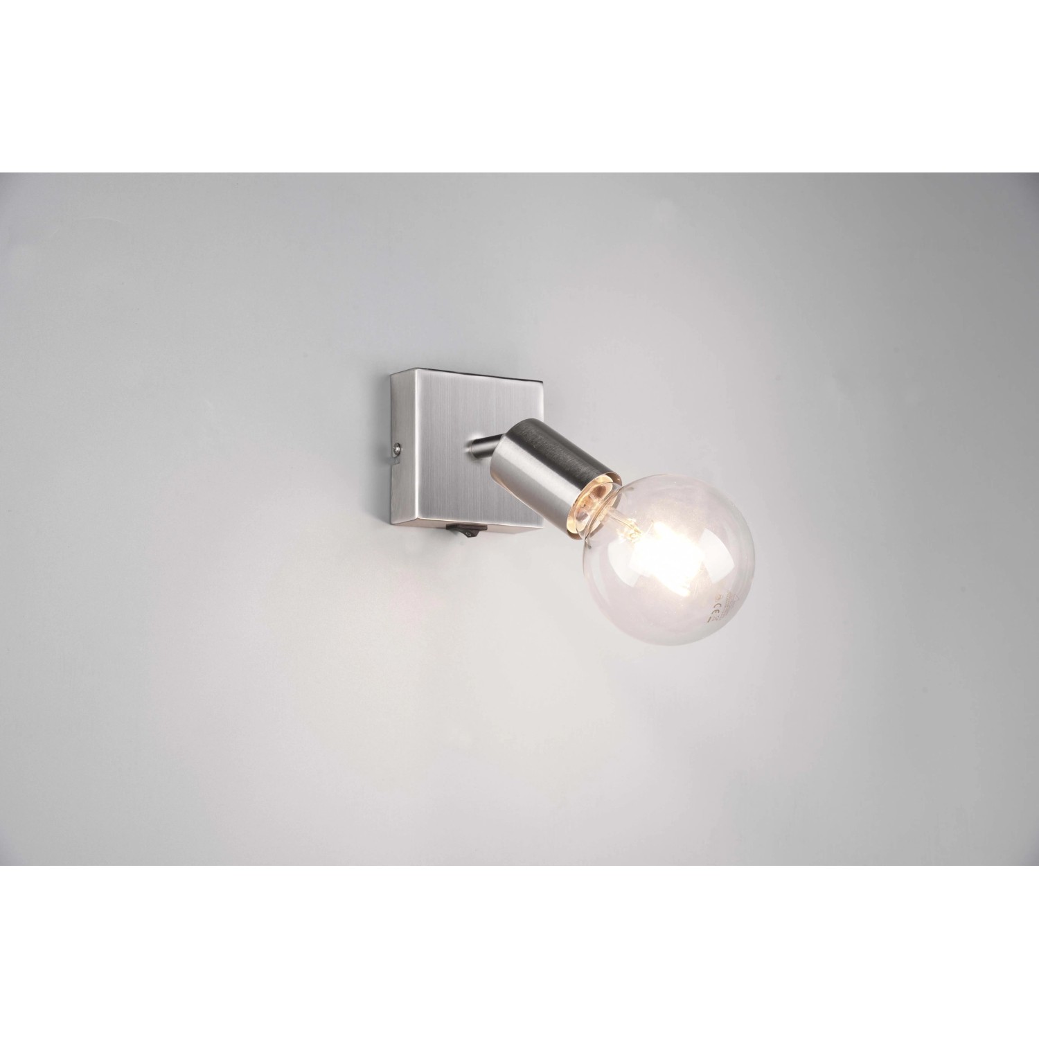 Faretto t.b.t. moderno, color argento, per montaggio a parete. Ideale come illuminazione d'accento.