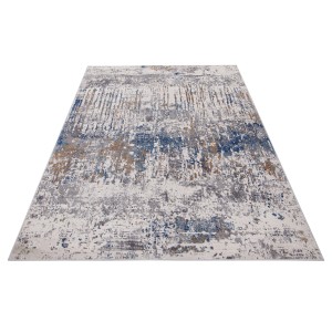 Tappeto moderno con motivo astratto in blu, grigio e beige.