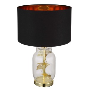 Elegante lampada da scrivania con paralume nero e foglia di ginkgo dorata nella base in vetro.