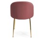 Sedia imbottita rosa con gambe dorate, vista posteriore.