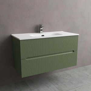 Mobile bagno verde con due cassetti e lavabo bianco.