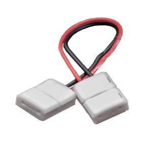 Connettore per strisce LED t.b.t. con cavi rossi e neri.