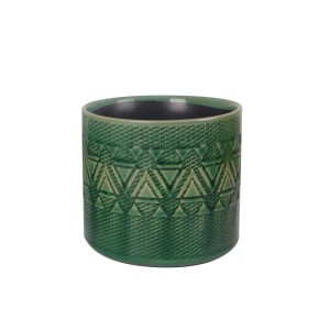 Vaso decorativo verde con motivo geometrico per interni.