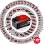 Batteria Einhell Power X-Change con vari utensili della serie sullo sfondo.
