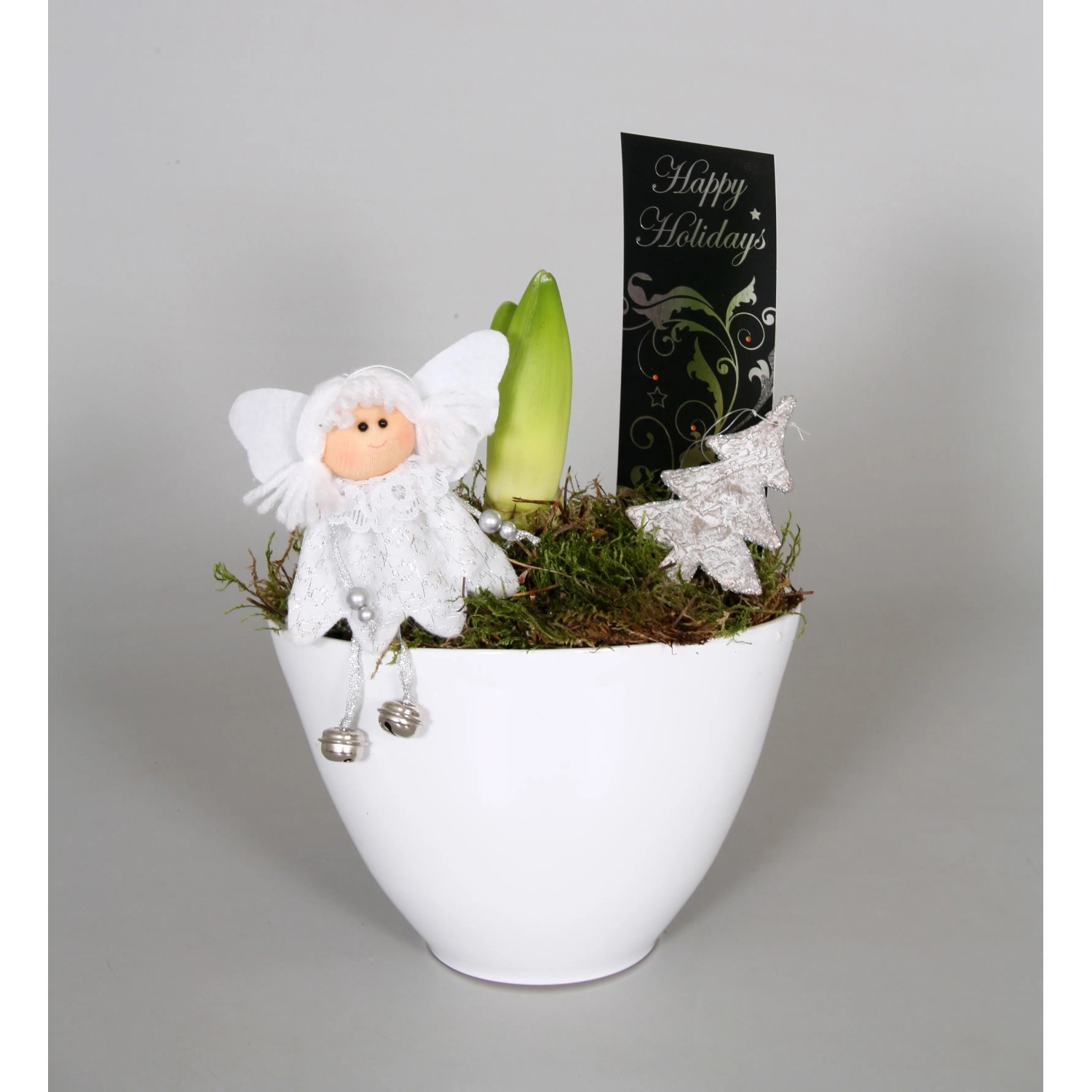 Composizione di Amaryllis in vaso di ceramica bianca con angelo e decorazioni.