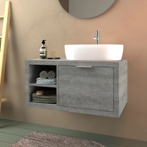 Mobile bagno grigio con lavabo d'appoggio e asciugamani. Arredo bagno.
