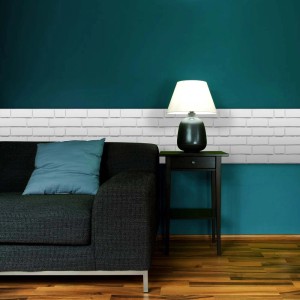 Soggiorno con pannelli murali 3D bianchi come decorazione da parete.