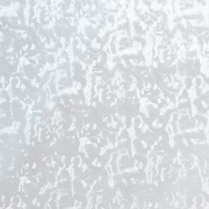 Primo piano di pellicola adesiva t.b.t. chiara e strutturata.