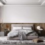 Camera da letto con pannelli decorativi t.b.t. come elemento decorativo dietro il letto.