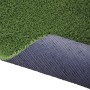 Erba sintetica t.b.t. con superficie verde e retro scuro.