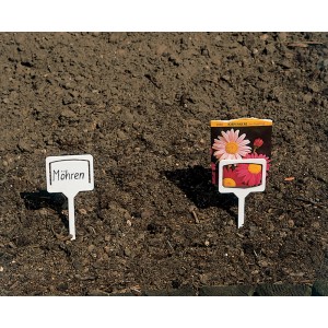 Foto di etichette per piante bianche (10 pz.) nell'aiuola, una etichettata "carote", una con sacchetto di semi.