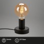 Lampada da tavolo nera Brilo Teepu con attacco E27 e lampadina a luce calda.