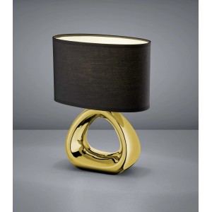 Lampada da scrivania moderna con base dorata e paralume nero.