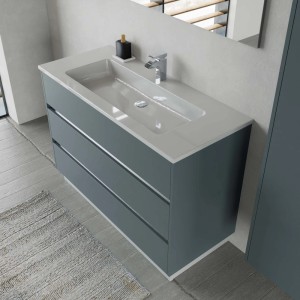Mobile bagno grigio con tre cassetti e lavabo da appoggio bianco.