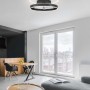 Plafoniera LED moderna t.b.t. in nero, design circolare per un'illuminazione elegante.