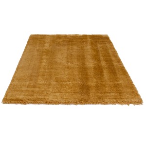 Tappeto a pelo lungo dorato per spazi abitativi.