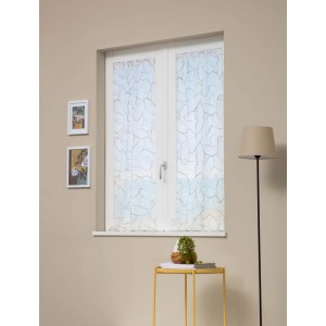 Tenda a vetro decorativa e trasparente con motivo astratto davanti alla finestra.