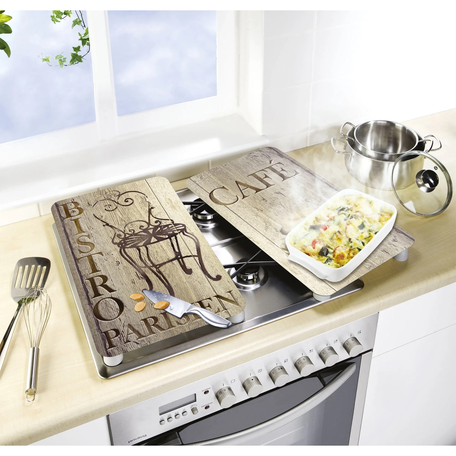 Wenko Coprifornelli Bistro set da 2 su piano cottura: Coperture in vetro con design bistro per protezione e tagliere.